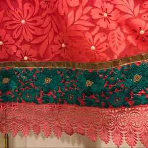 Peach colored embroidered Indian/Pakistani dress.